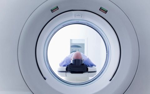 person going in to a MRI scanner