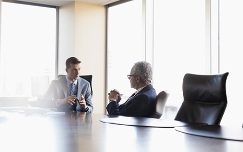 Businessmen meeting in a boardroom