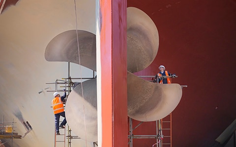 Engineers maintaining ship propellers