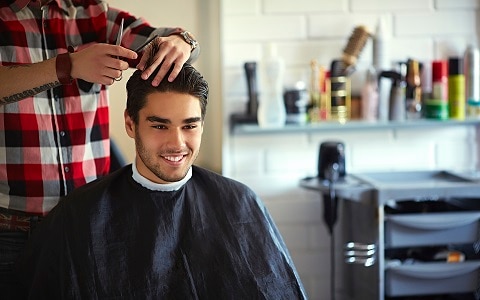 customer getting haircut at a hairdresser